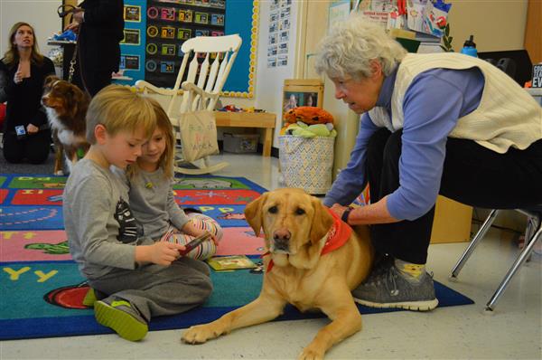 East Bradford students read to dogs. 