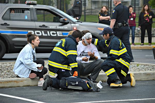 Emergency personnel treat student actors during Henderson's Mock Crash 