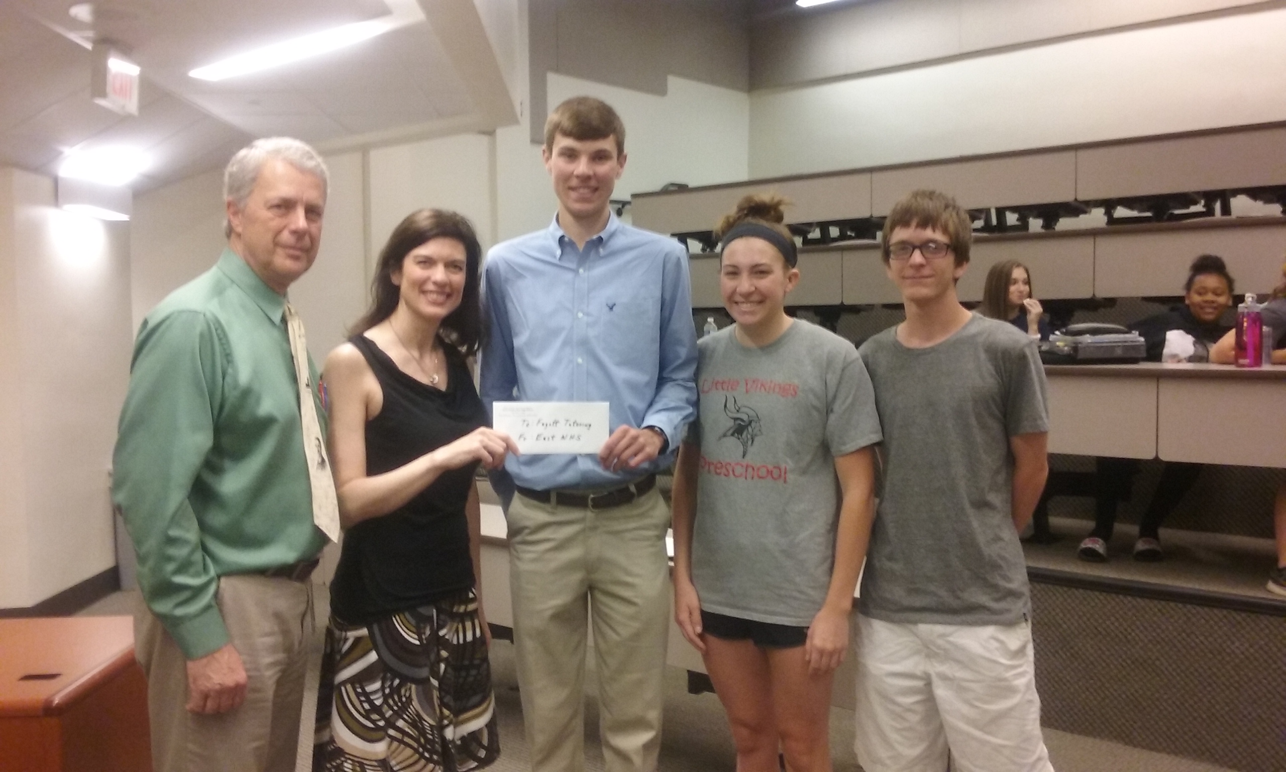 EHS NHS gifts check to FMS tutoring program